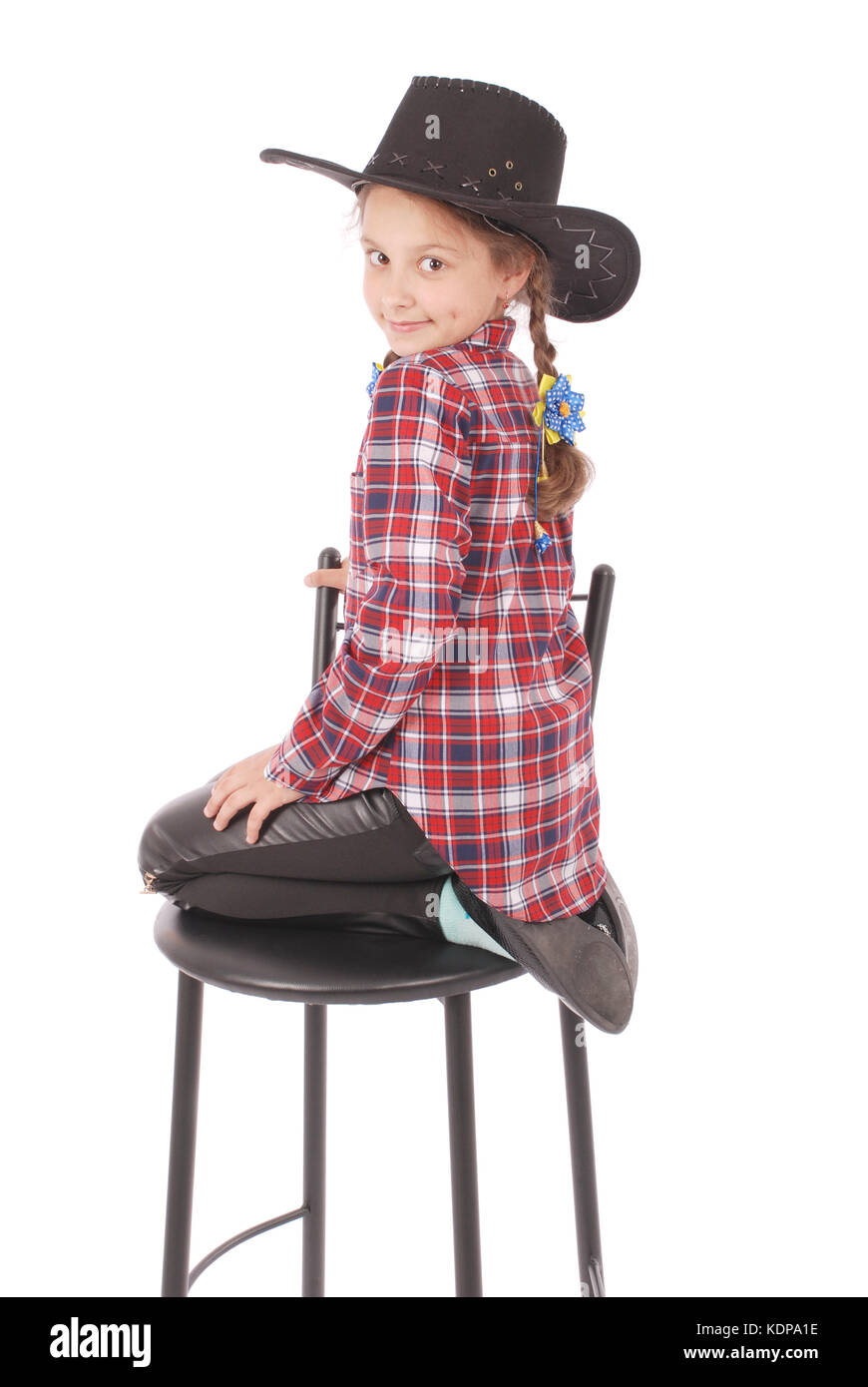 Portrait of adorable smiling little girl sitting on a chair with her ...