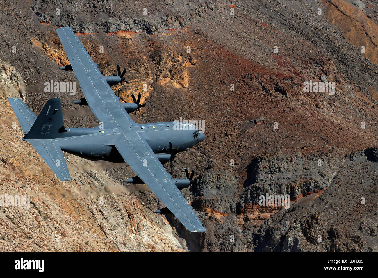C-130 flies low through Jedi transition in Death Valley, California. Stock Photo