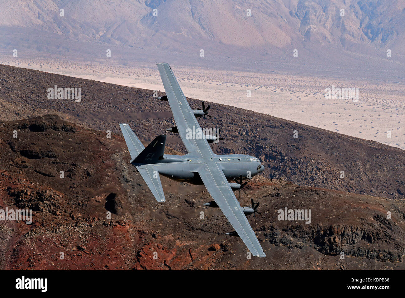 C-130 flies low through Jedi transition in Death Valley, California. Stock Photo