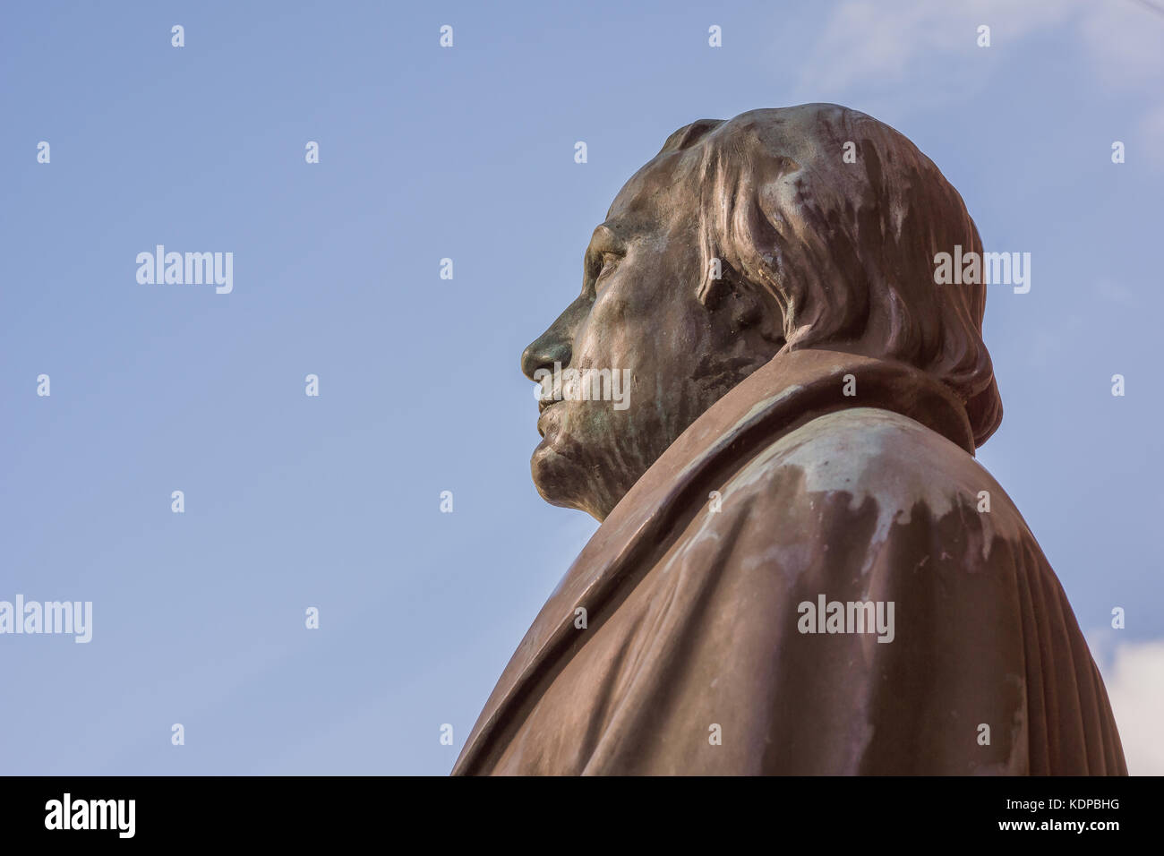 bronze statue of the reformer Martin Luther against blue sky. Profile from the left side. Copenhagen, July 6, 2016 Stock Photo