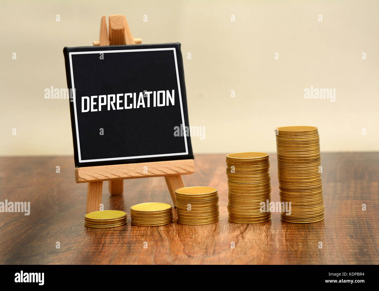 Depreciation Sign with currency gold coins stack Stock Photo Alamy