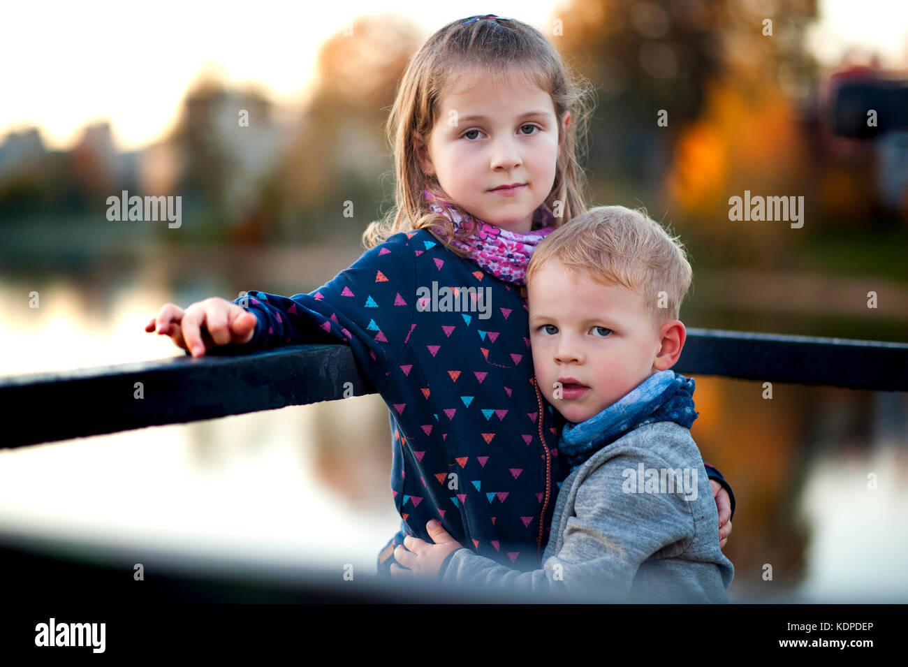 siblings enjoying nice colourful autumn Stock Photo