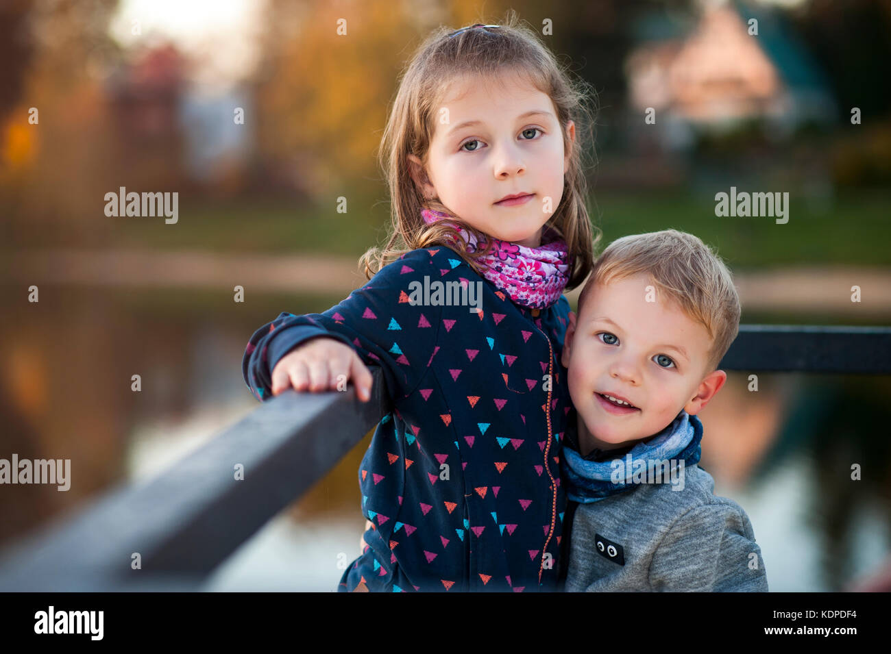 siblings enjoying nice colourful autumn Stock Photo
