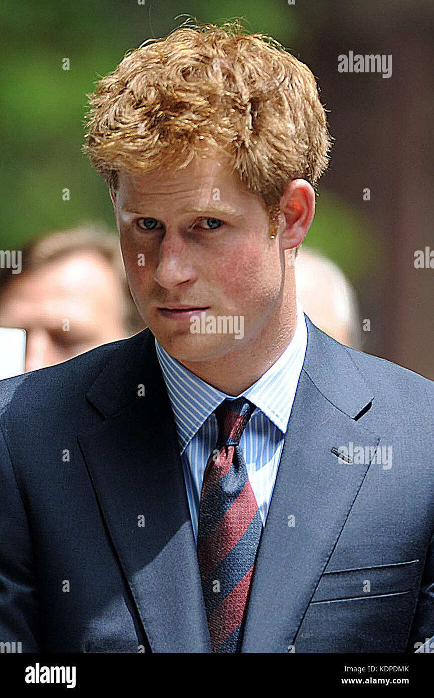 NEW YORK - MAY 29:  Britainís Prince Harry After the WTC visit, it was on to the British Garden in Manhattanís Hanover Square, where crowd of more than 1,000 people cheered as the Prince arrived. Women wearing elaborate hats leant from the first-floor windows of India House opposite the square, which was established in 1730.  Harry officially named the garden before holding a private meeting with families of Americans and the 67 Britons killed on September 11.  Camilla Hellman, president of the British Memorial Garden Trust, is an old hand at royal visits ó The Princess Royal, the Prince of Wa Stock Photo