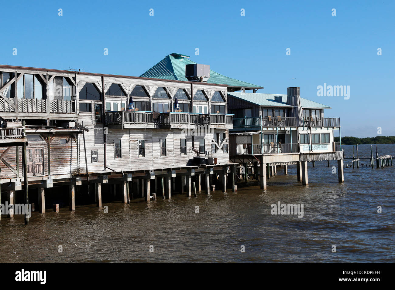 Historic waterfront buildings on stilts in Cedar Key, FL. Cedar Key is