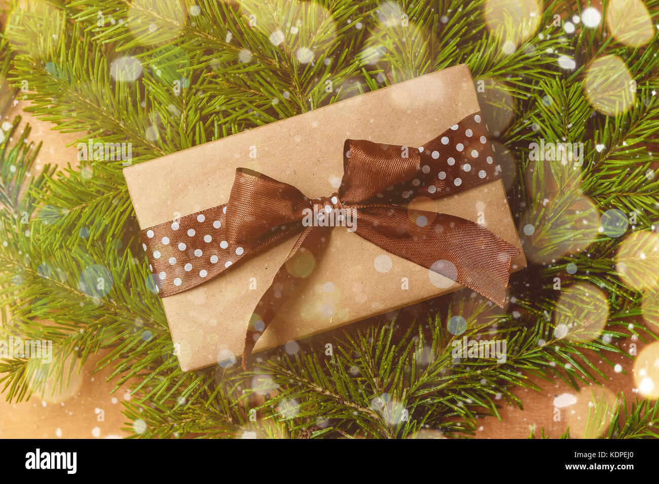 Pile of Christmas wrapped presents with twine string roll, fir tree branch,  Christmas toy star at wooden background. Xmas decoration, cozy festive  Stock Photo - Alamy