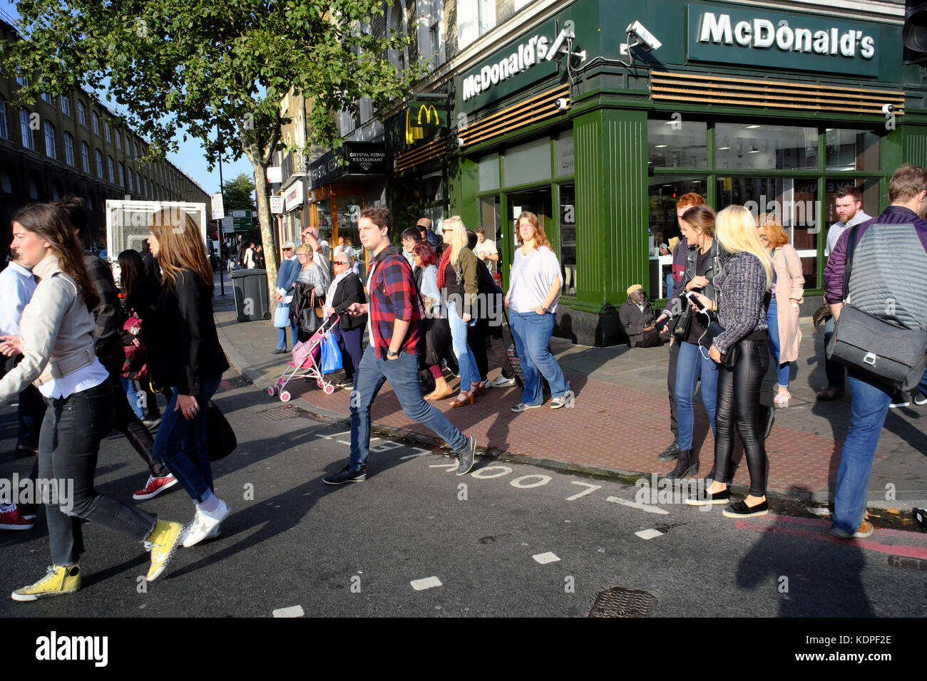 People crossing road near Mcdonald's by Kings Cross, Islington, London, England Stock Photo Alamy