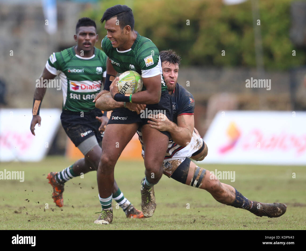 Colombo, Sri Lanka. 15th Oct, 2017. Player of Sri Lanka is tackled by Player of  Hong Kong  during the Asia Rugby Men's Sevens 2017 match between Sri Lanka and Hong Kong at Race Course Ground on 15 October 2017 in Colombo, Sri Lanka.  Credit: Lahiru Harshana/Alamy Live News Credit: Lahiru Harshana/Alamy Live News Stock Photo