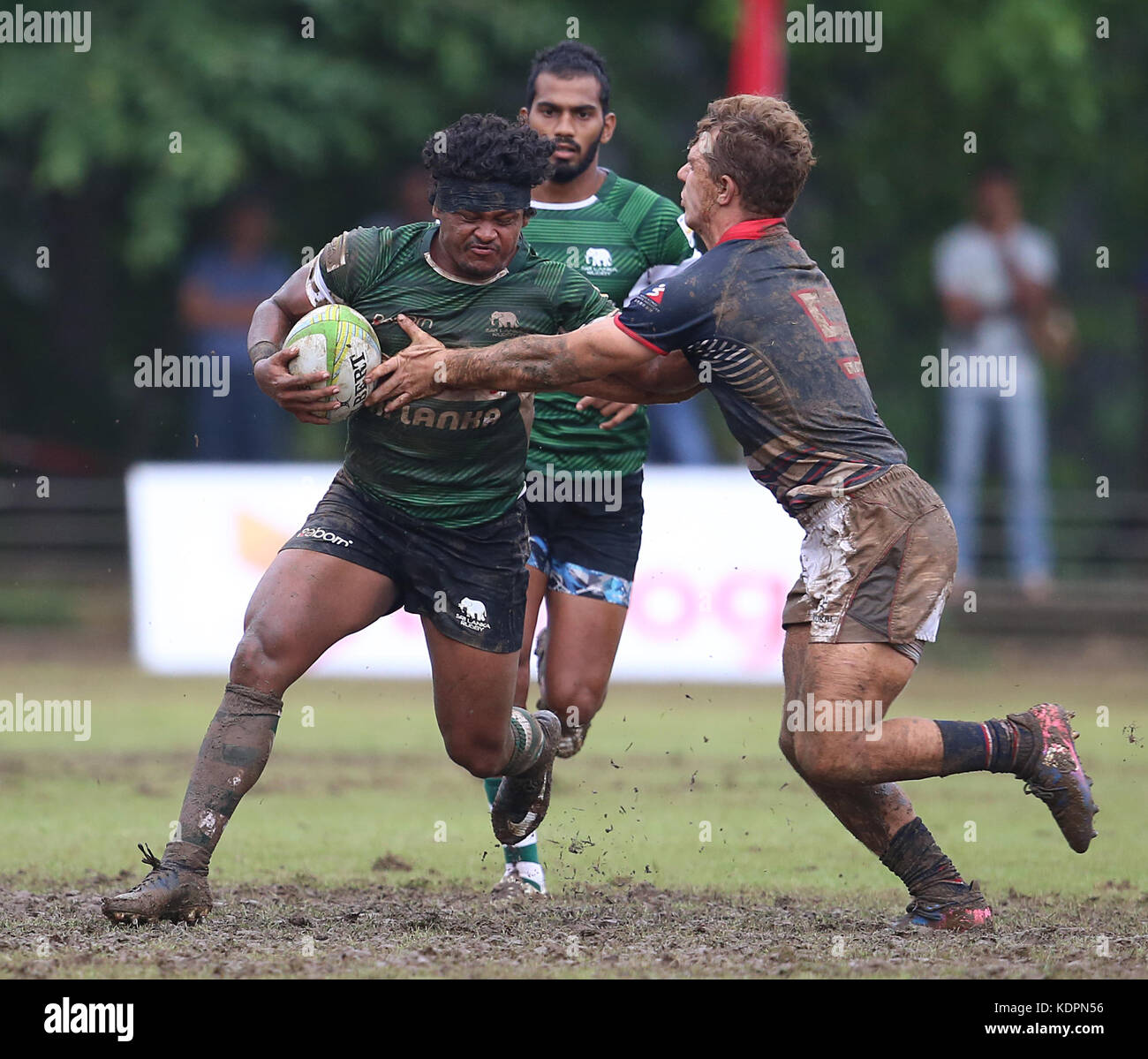 Colombo, Sri Lanka. 15th Oct, 2017. Player of Sri Lanka is tackled by Player of  Hong Kong  during the Asia Rugby Men's Sevens 2017 match between Sri Lanka and Hong Kong at Race Course Ground on 15 October 2017 in Colombo, Sri Lanka.  Credit: Lahiru Harshana/Alamy Live News Credit: Lahiru Harshana/Alamy Live News Stock Photo