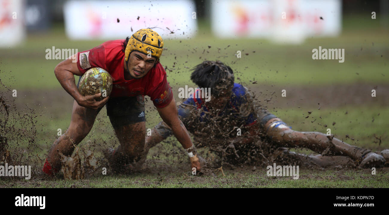Colombo, Sri Lanka. 15th Oct, 2017. Player of Malaysia is tackled by Player of Chinese Taipei during the Asia Rugby Men's Sevens 2017 match between Malaysia and Chinese Taipei at Race Course Ground on 15 October 2017 in Colombo, Sri Lanka. Credit: Lahiru Harshana/Alamy Live News Stock Photo