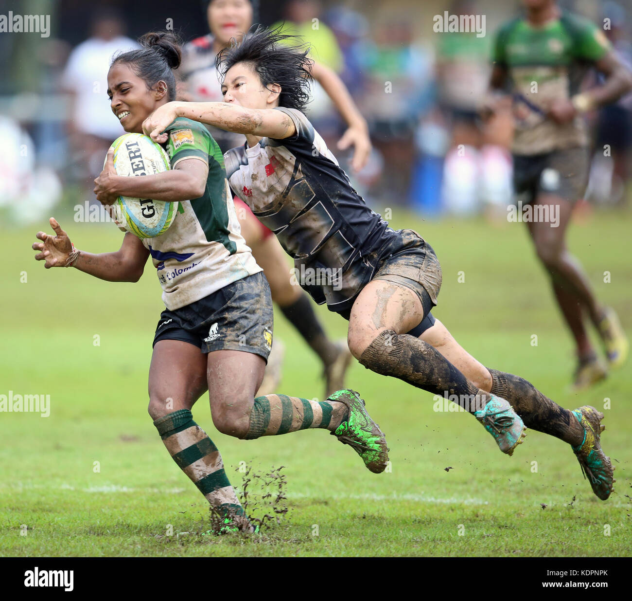 Colombo, Sri Lanka. 15th Oct, 2017. Player of Sri Lanka is tackled by Player of  Singapore during the Asia Rugby Women's Sevens 2017 match between Sri Lanka and Singapore at Race Course Ground on 15 October 2017 in Colombo, Sri Lanka. Credit: Lahiru Harshana/Alamy Live News Stock Photo