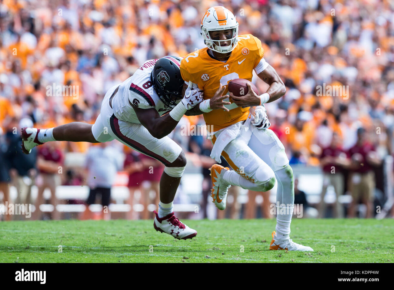 South Carolina defensive lineman D.J. Wonnum (8) brings down Tennessee  running back John Kelly (4) at Neyland Stadium on Saturday, Oct. 14, in  Knoxville, Tenn. (C.B. Schmelter/Chattanooga Times Free Press via AP