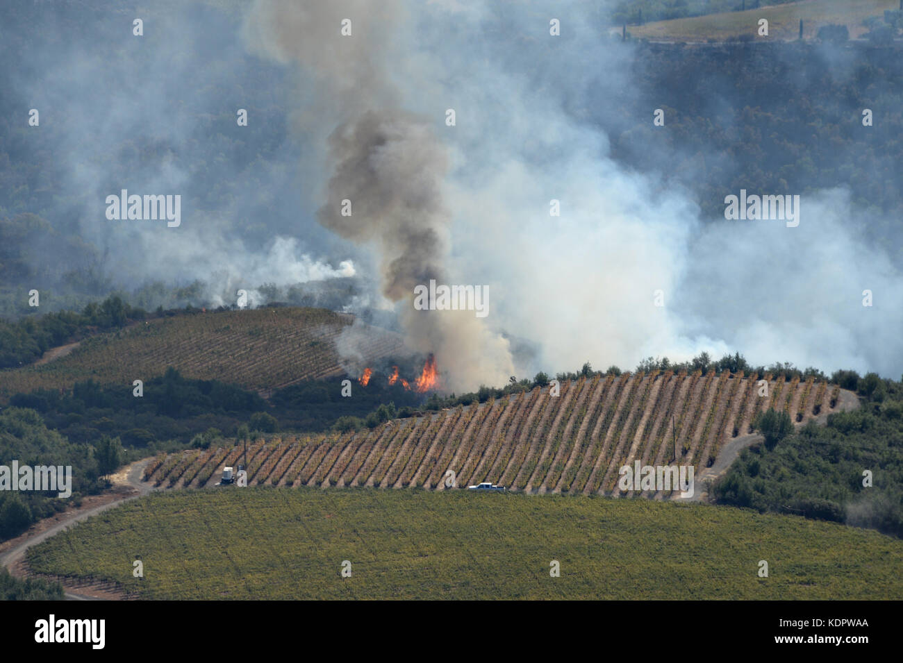 Wild fires burning in the hills and vineyards of Sonoma County October 12, 2017 near Santa Rosa, California. Stock Photo