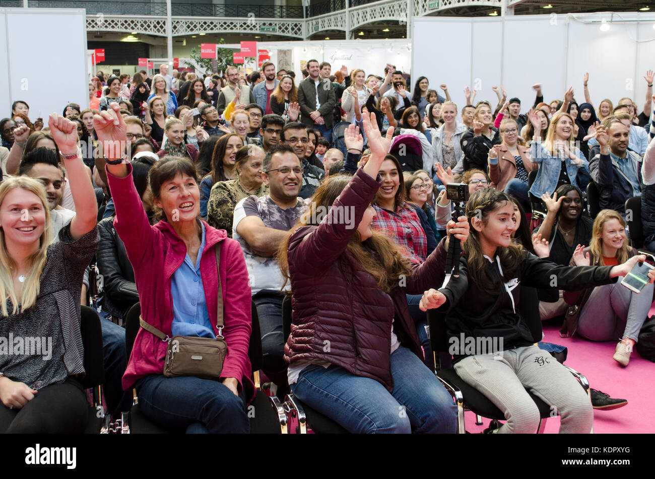 The Chocolate Show 2017 at Olympia. Audience participation at the cookery demonstrations. Chocolate fans descended en masse for The Chocolate Show, 13th-15th October 2017, at Olympia, London, UK, which ended today. Featuring a wide range of exhibitors selling everything chocolate from around the world, tastings, demonstrations by leading chefs and chocolatiers, and chocolate art and fashion displays, the show experienced high visitor numbers across all three days. 15th October 2017. Credit: Antony Nettle/Alamy Live News Stock Photo