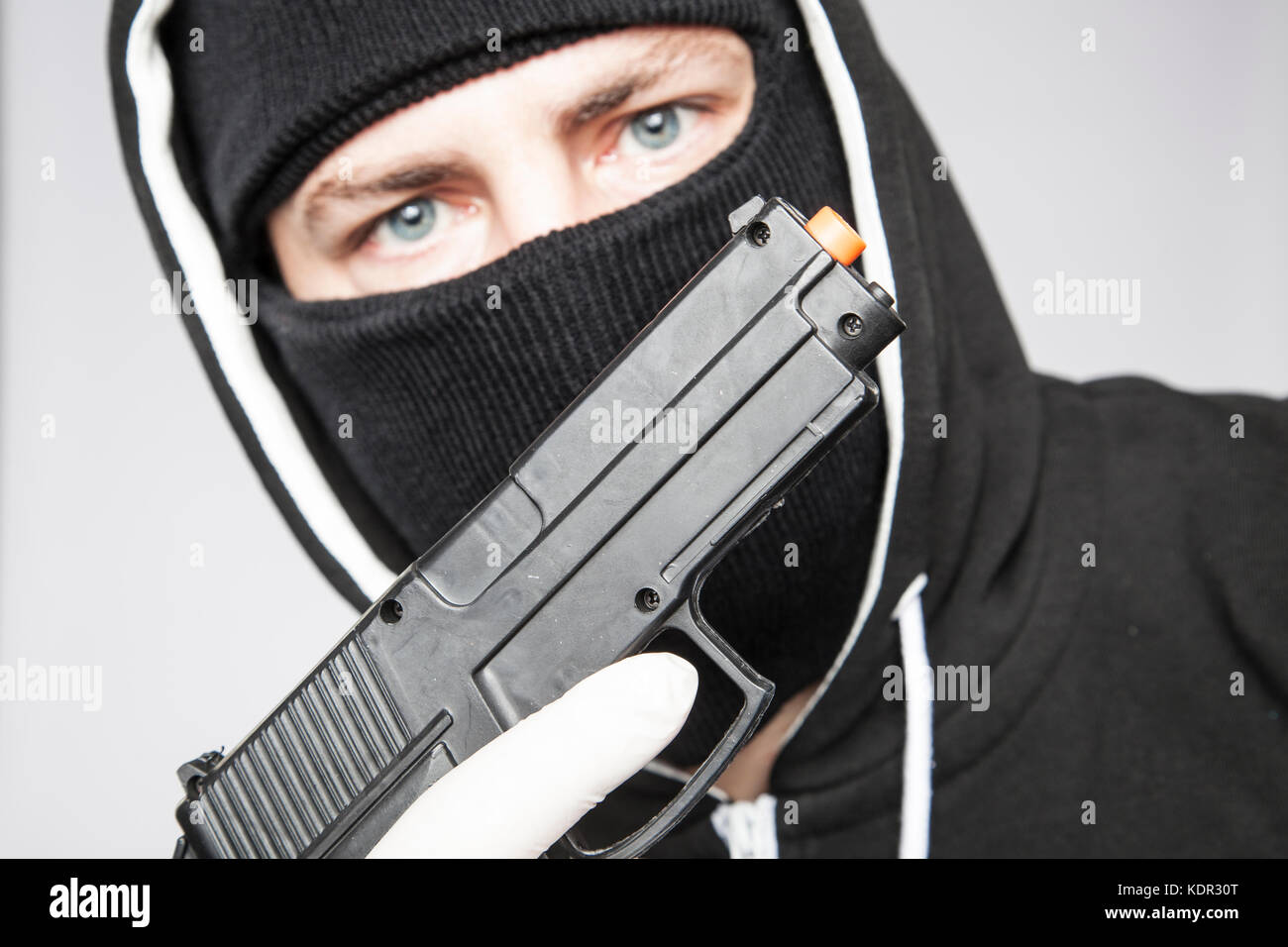 The terrorist shows the gun Stock Photo