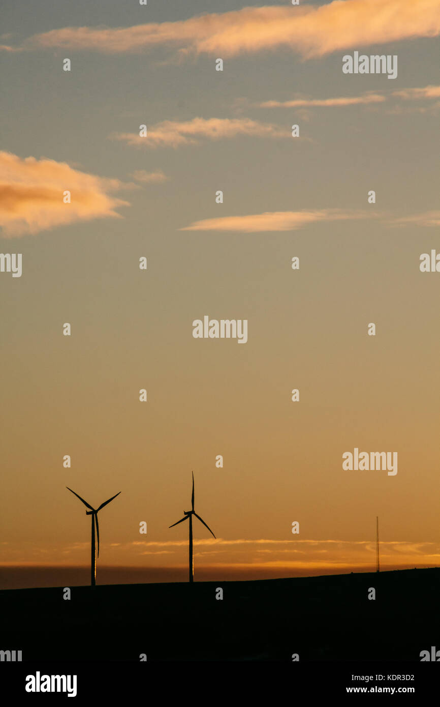 Wind turbines on a hill at sunset Stock Photo - Alamy
