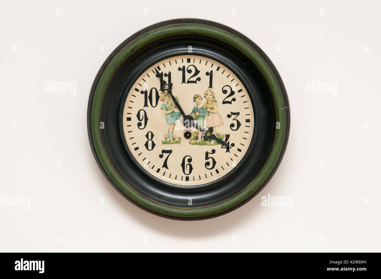 Vintage wall clock mounted on a plain white wall Stock Photo Alamy