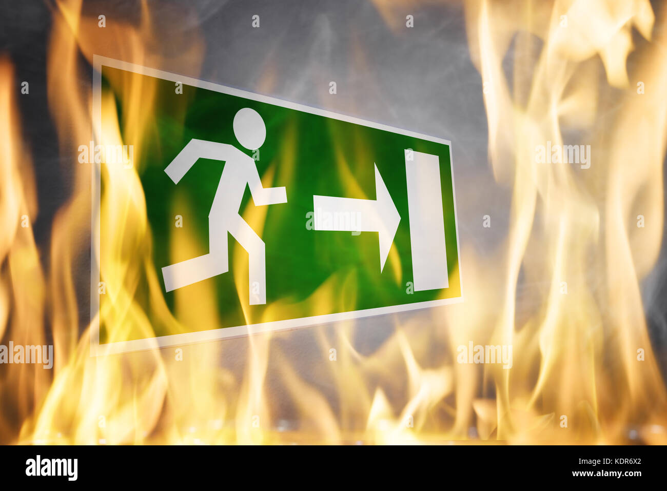 Close-up Of Emergency Fire Exit Board Burning In The Fire Flame Stock Photo