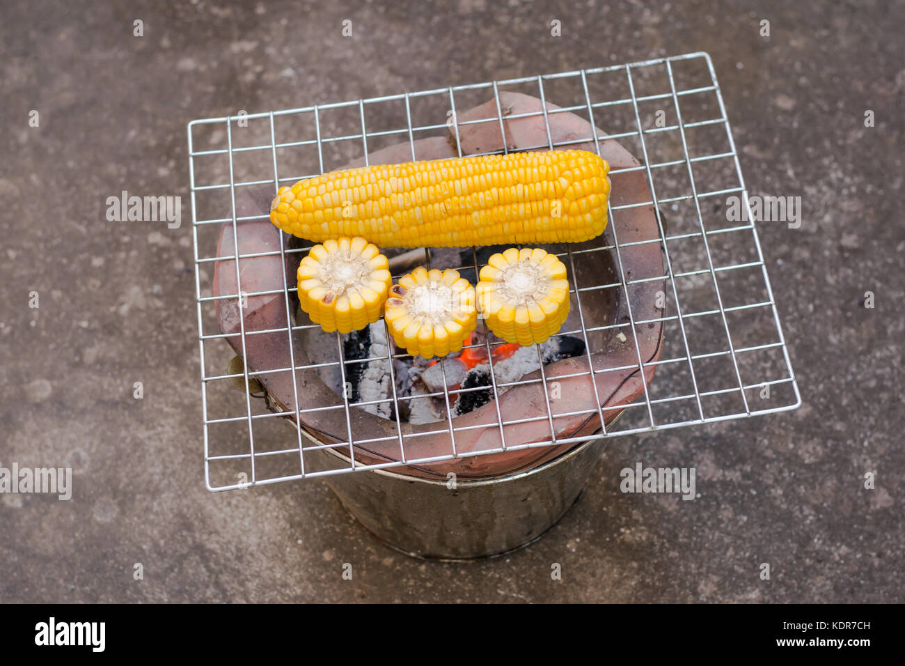 Cooking several fresh yellow brown golden corn cobs Stock Photo - Alamy