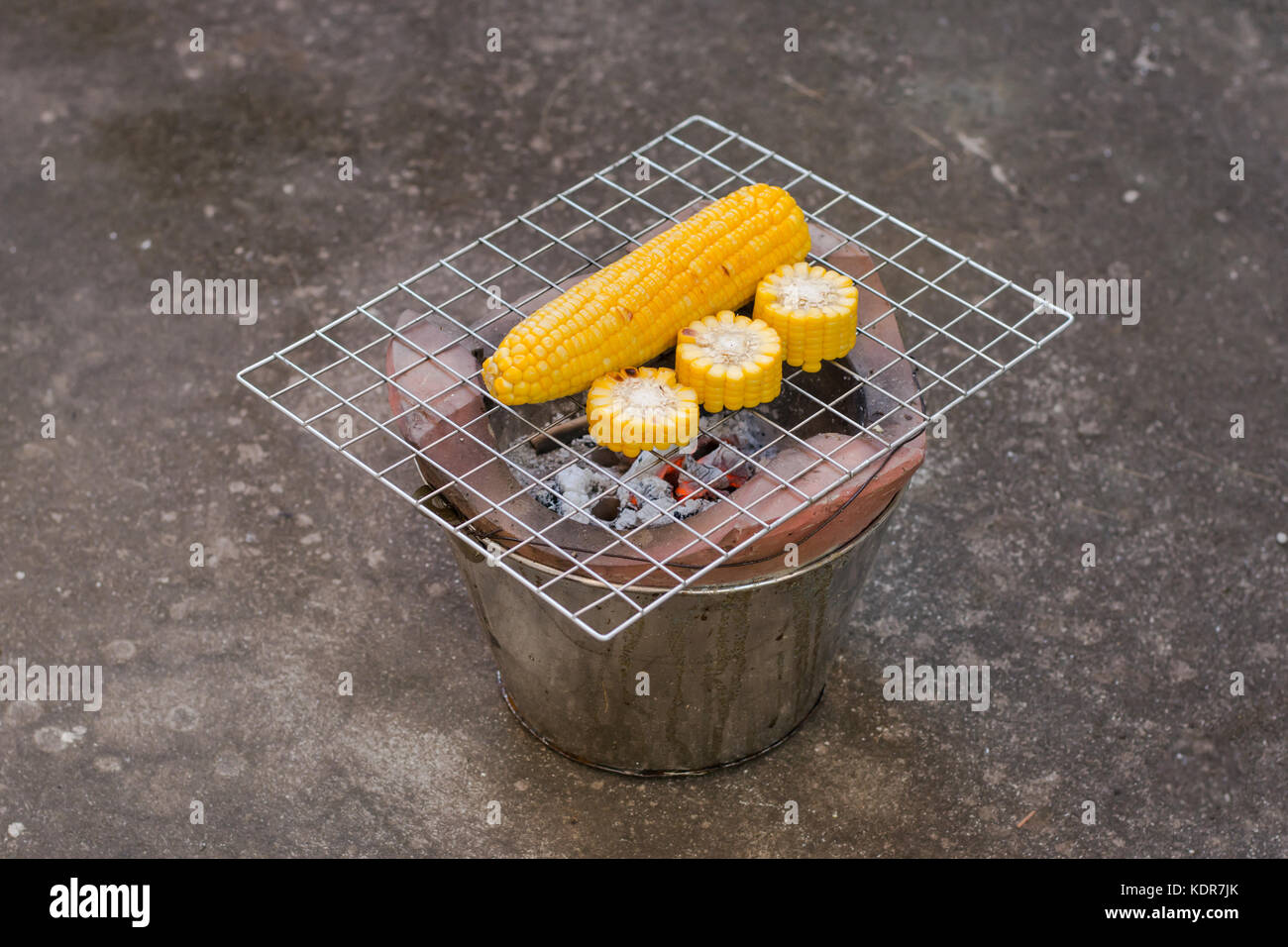 Cooking several fresh yellow brown golden corn cobs Stock Photo - Alamy
