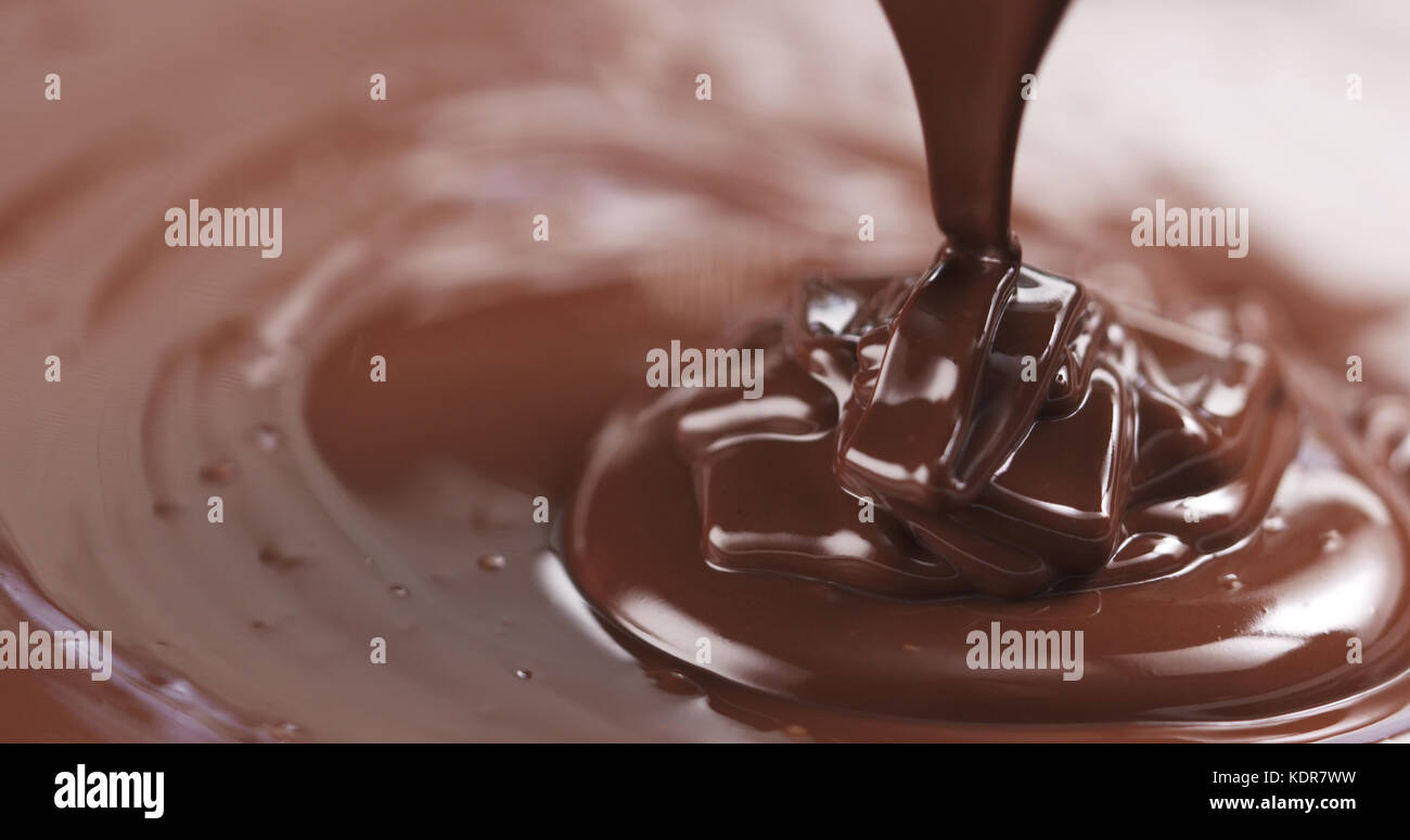 pouring dark melted chocolate Stock Photo - Alamy