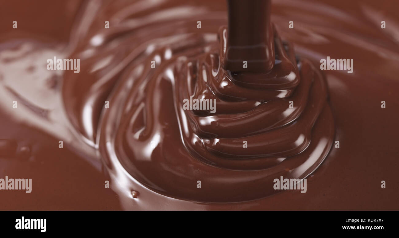 pouring dark melted chocolate Stock Photo - Alamy
