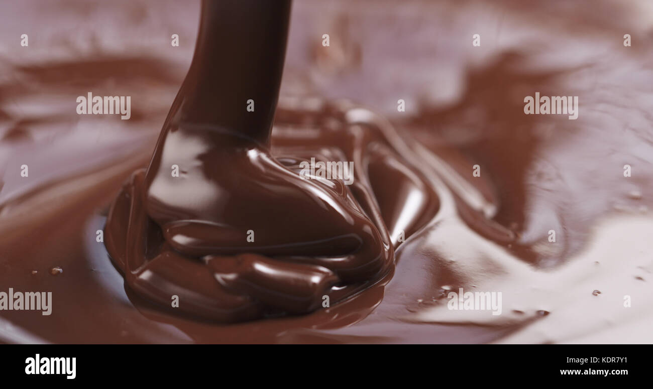 pouring dark melted chocolate Stock Photo - Alamy