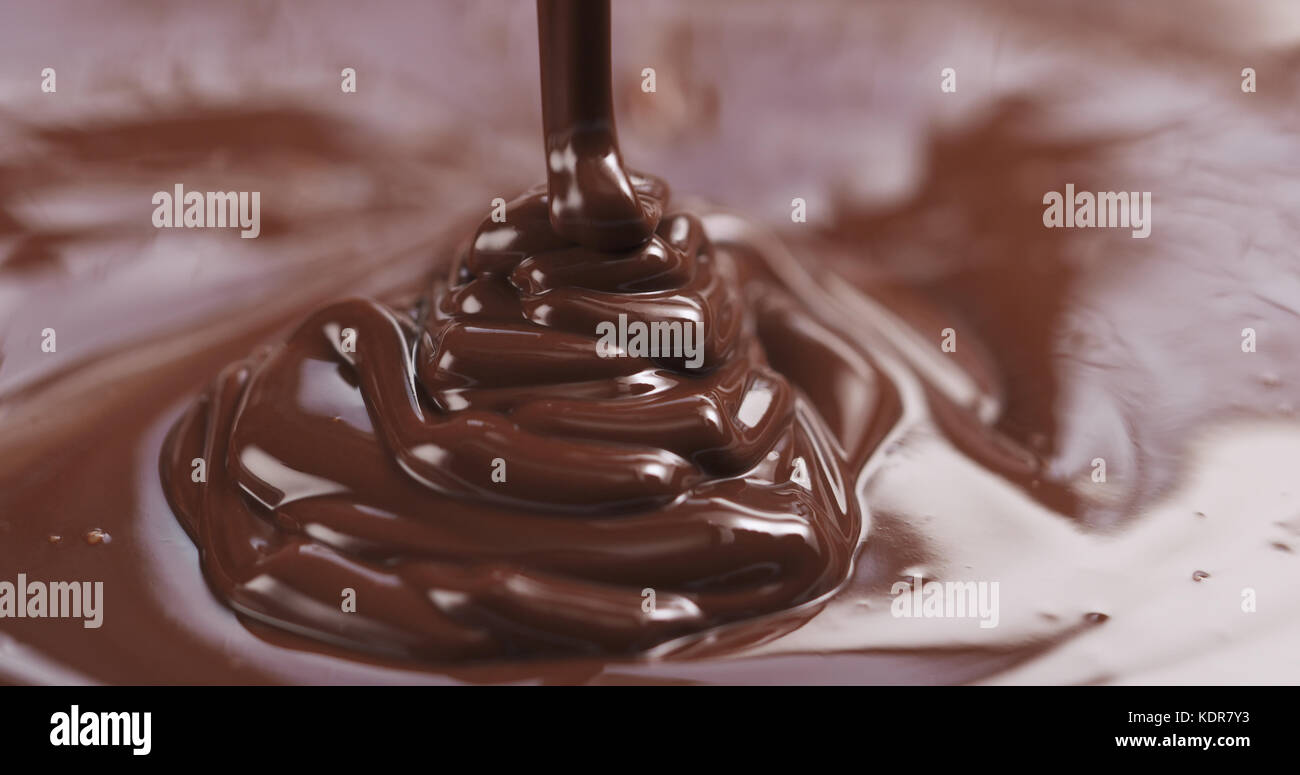 pouring dark melted chocolate Stock Photo - Alamy