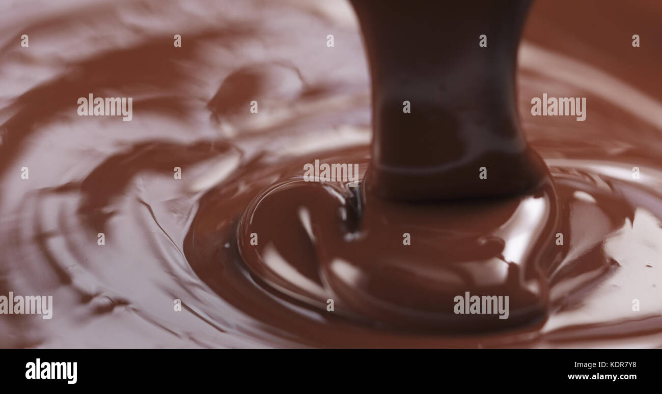 pouring dark melted chocolate Stock Photo - Alamy