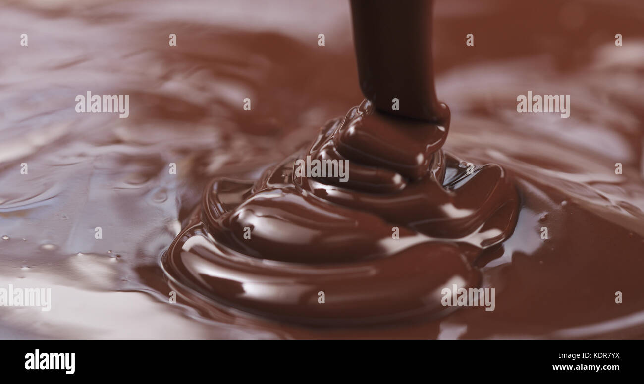 pouring dark melted chocolate Stock Photo - Alamy