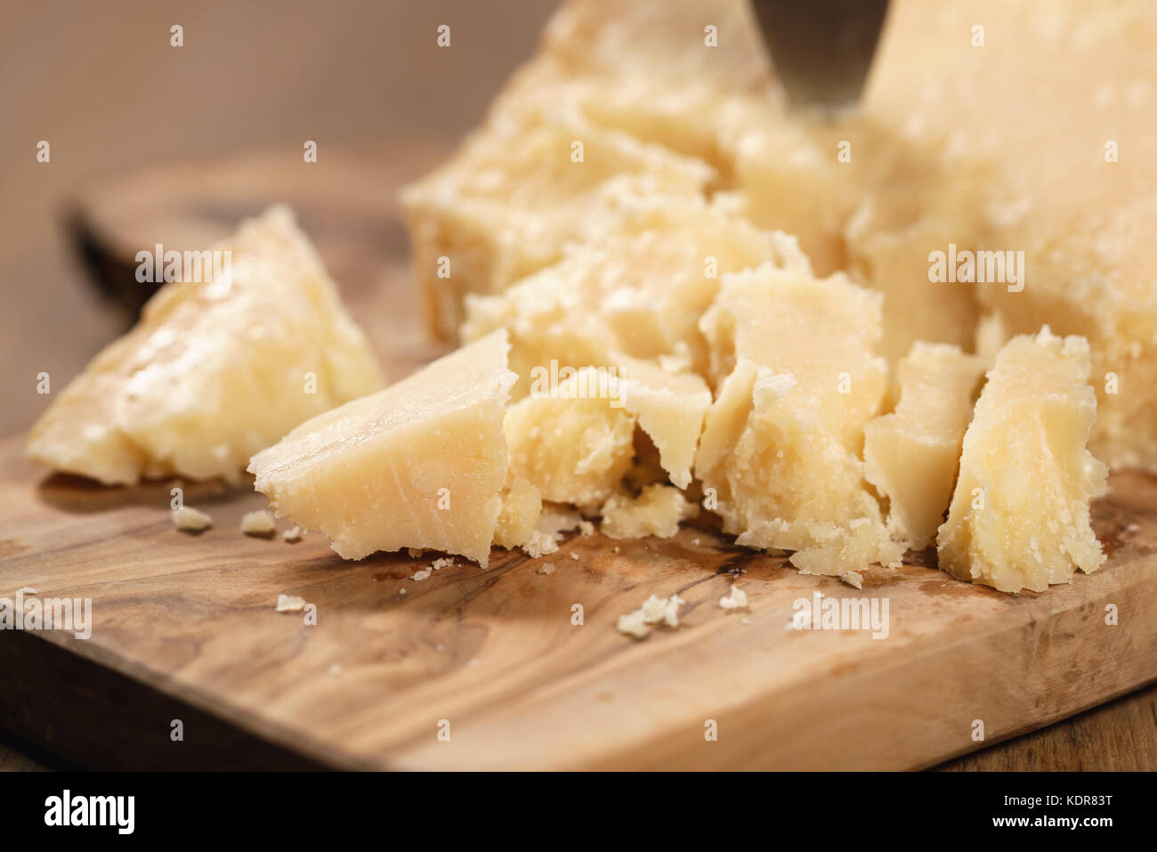 traditional grana padano italian cheese on olive board Stock Photo Alamy