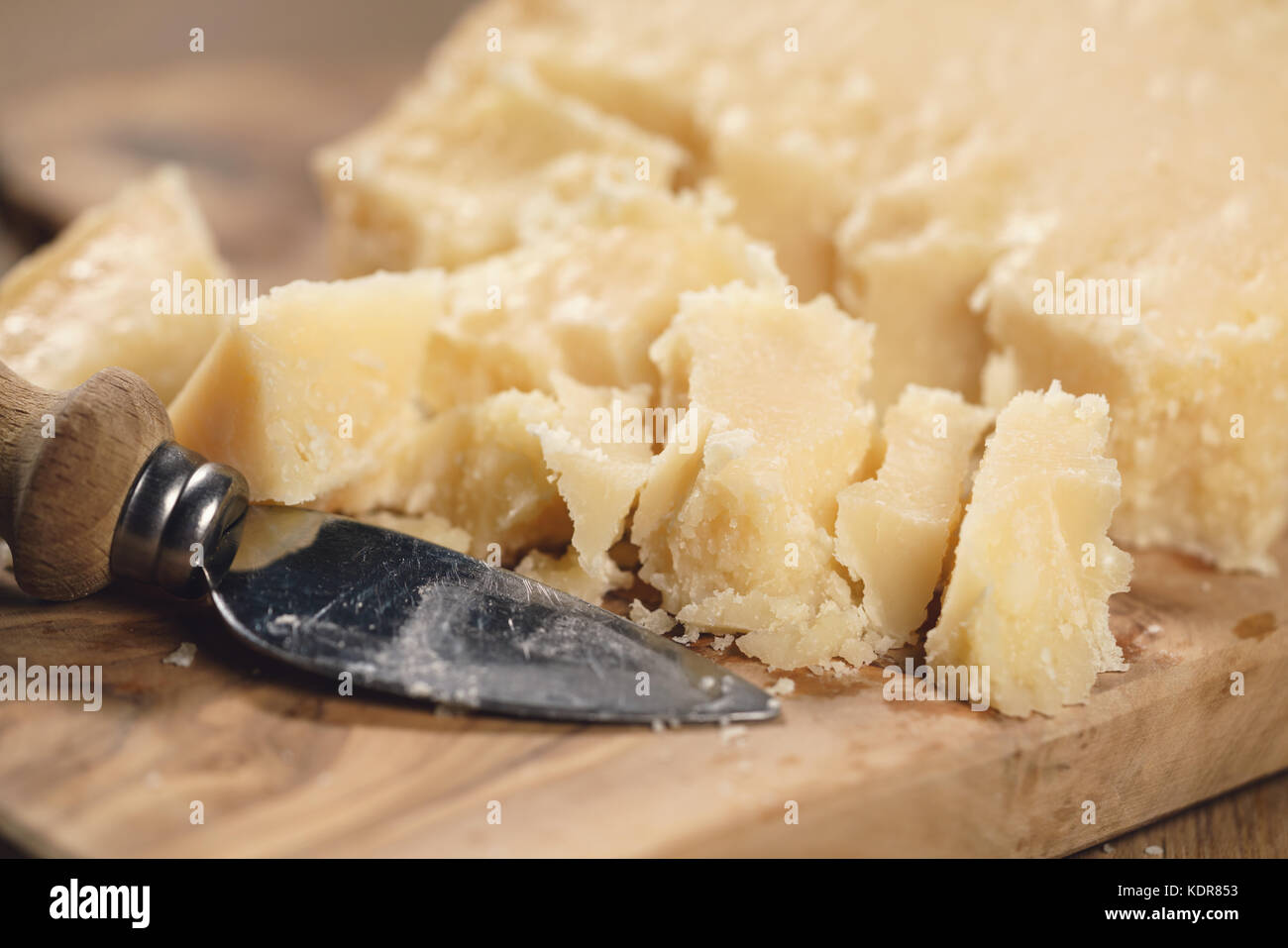 traditional grana padano italian cheese on olive board Stock Photo Alamy