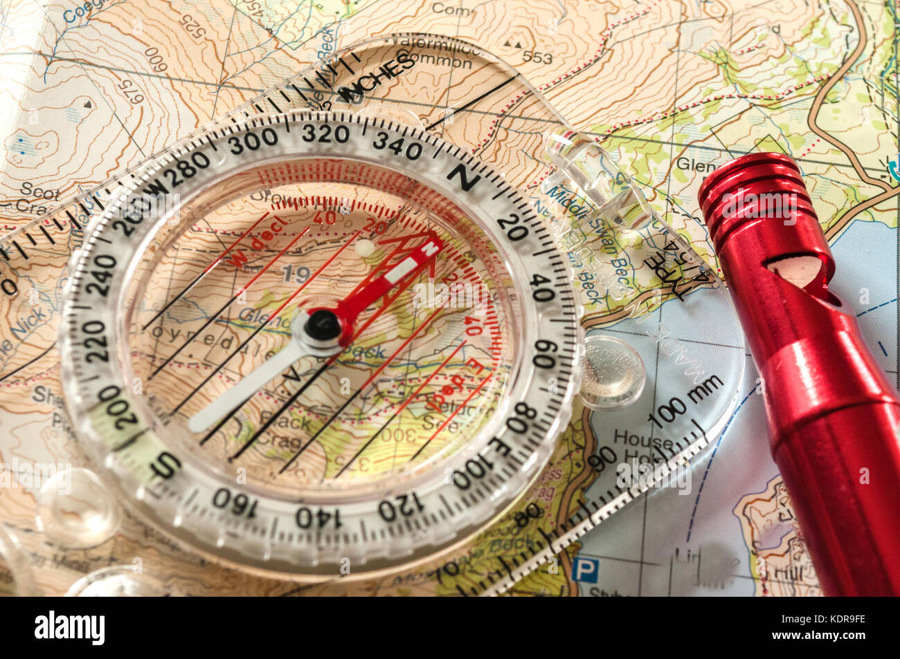 Compass showing direction on Topographic Map, with Rescue Whistle