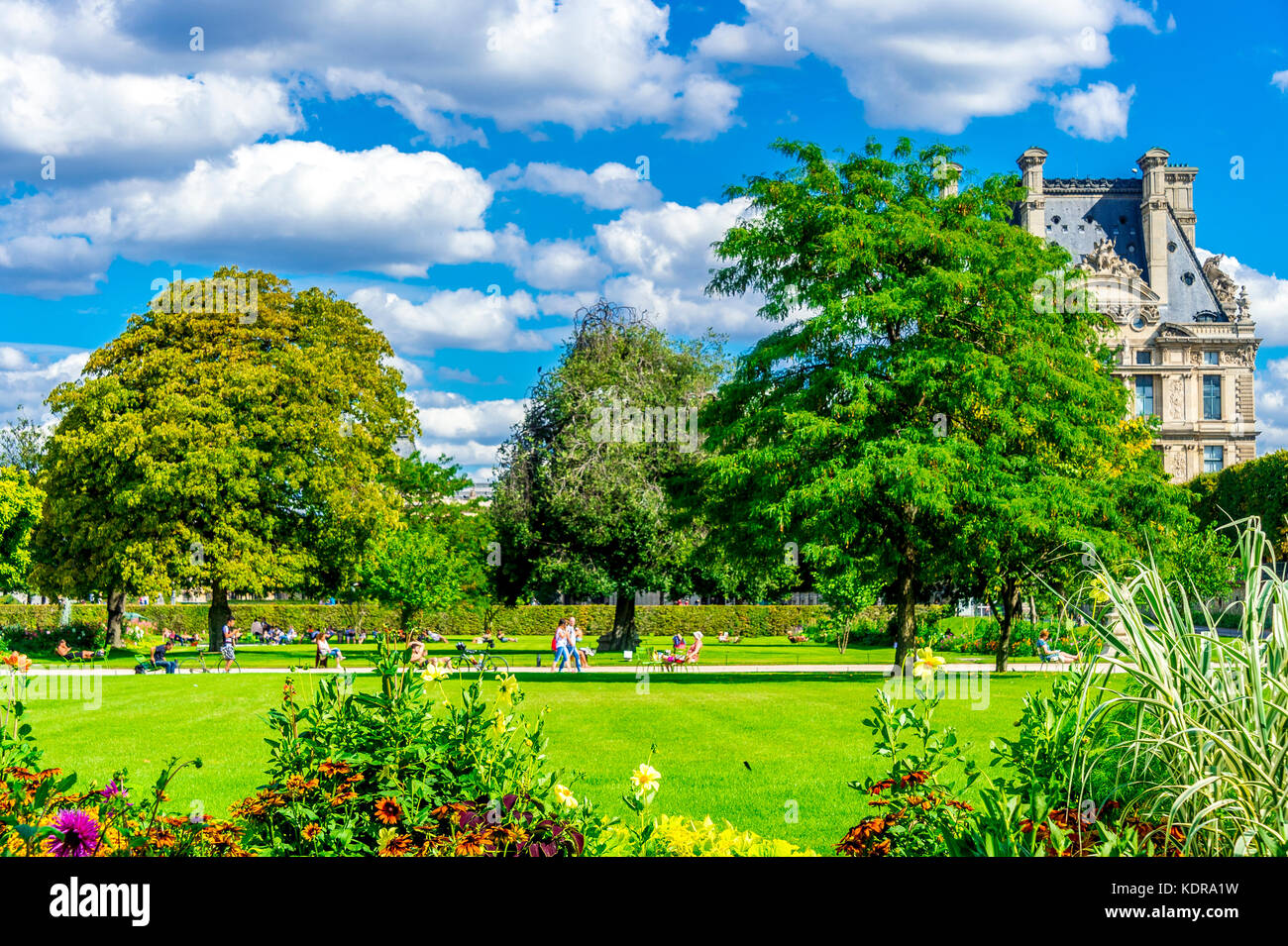 The Jardin des Tuileries (Tuileries Garden), and the beautiful architecture of the Louvre is on display in the background. Paris, France Stock Photo