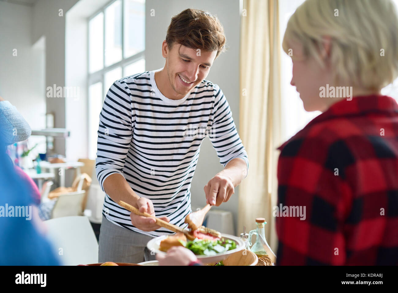 Friends Making Dinner Together Stock Photo