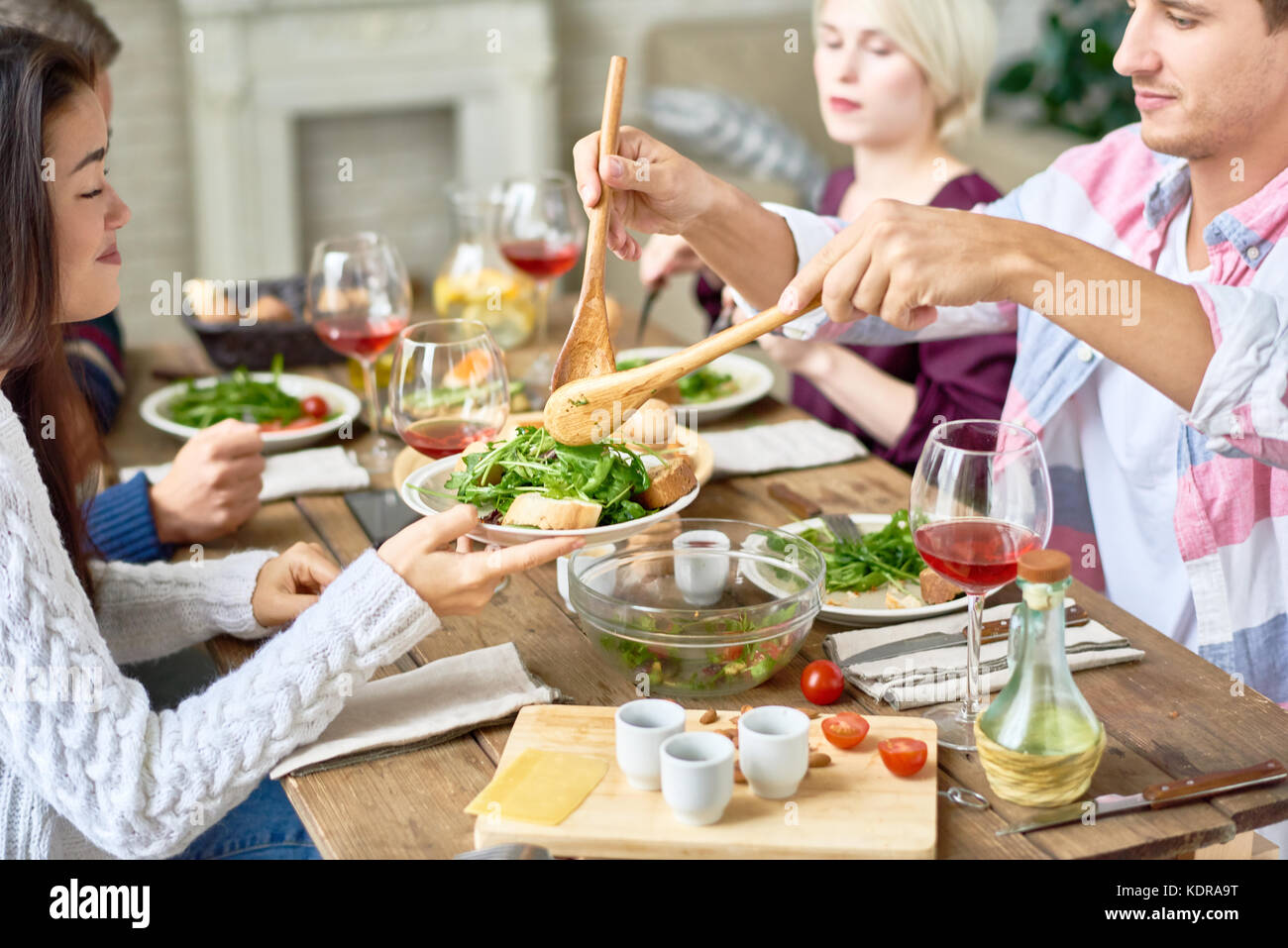 Friends Gathering at Dinner Table Stock Photo