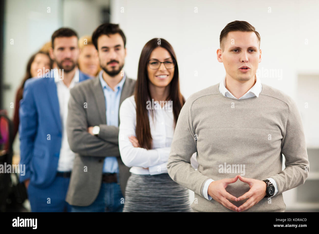 Team of cheerful businesspeople posing for group picture Stock Photo ...