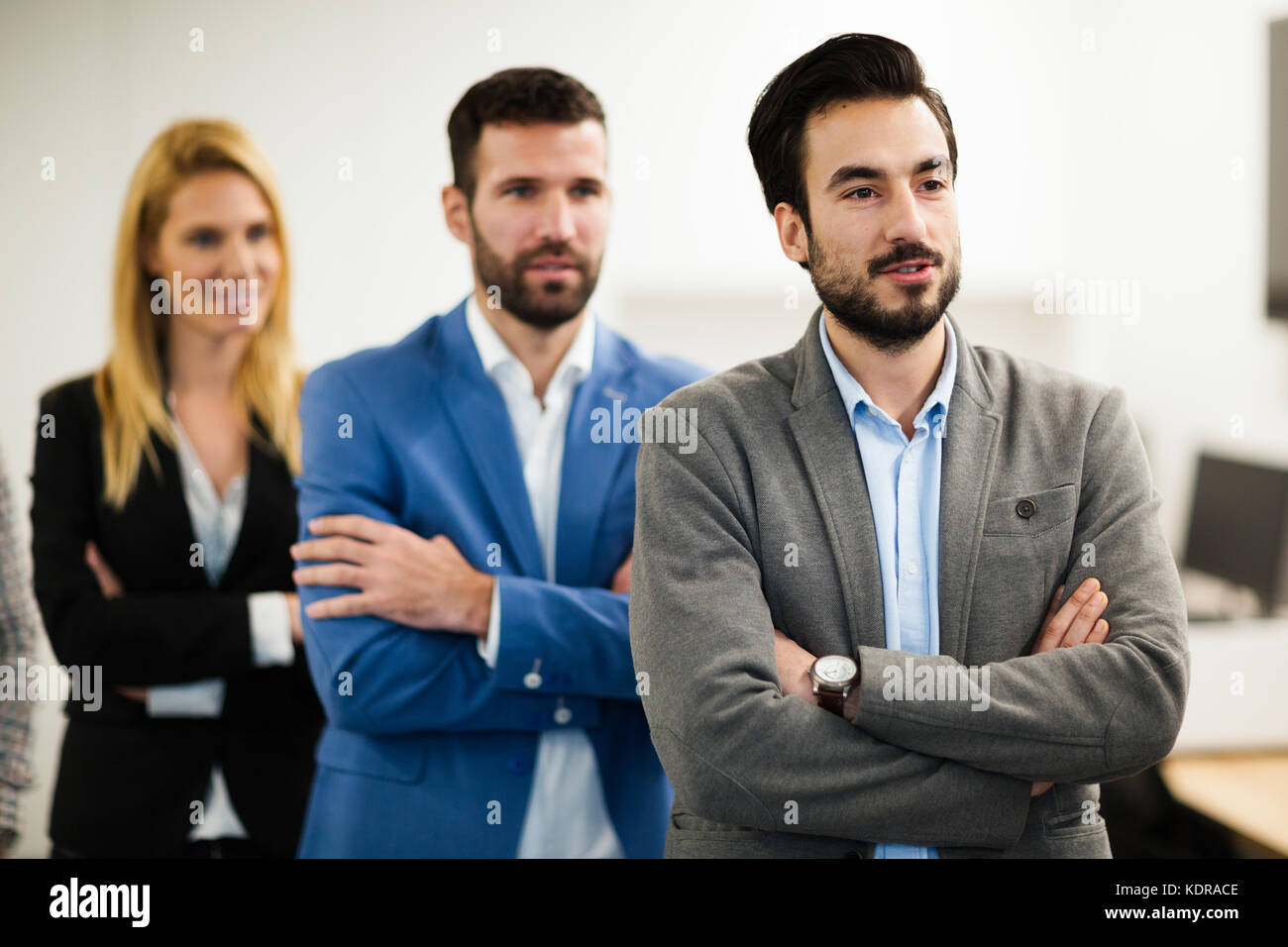 Team of cheerful businesspeople posing for group picture Stock Photo ...