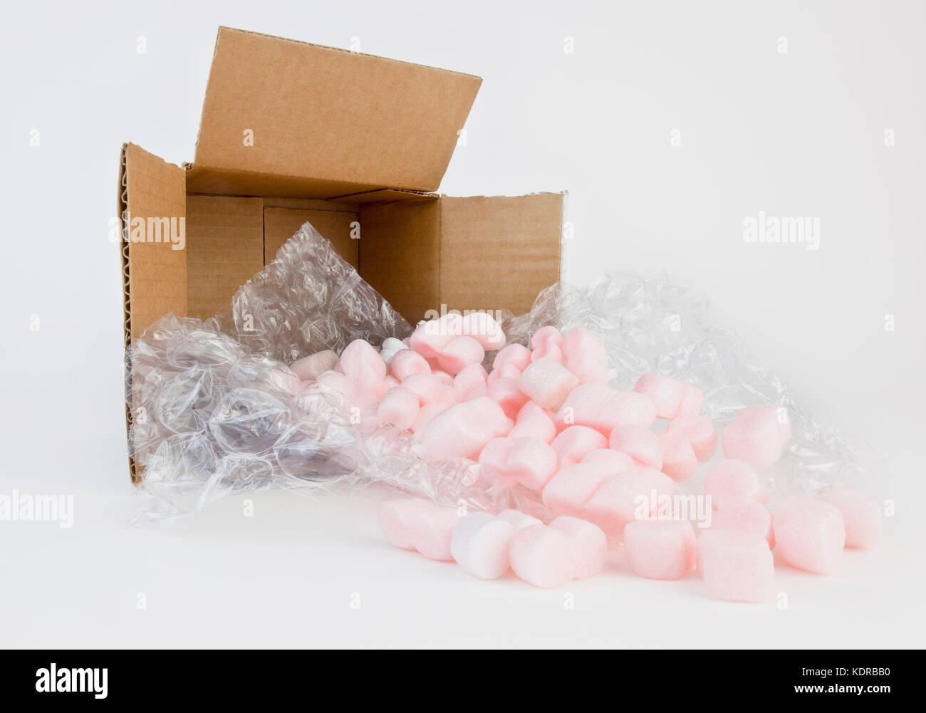 Open cardboard shipping box with packing materials. Stock Photo