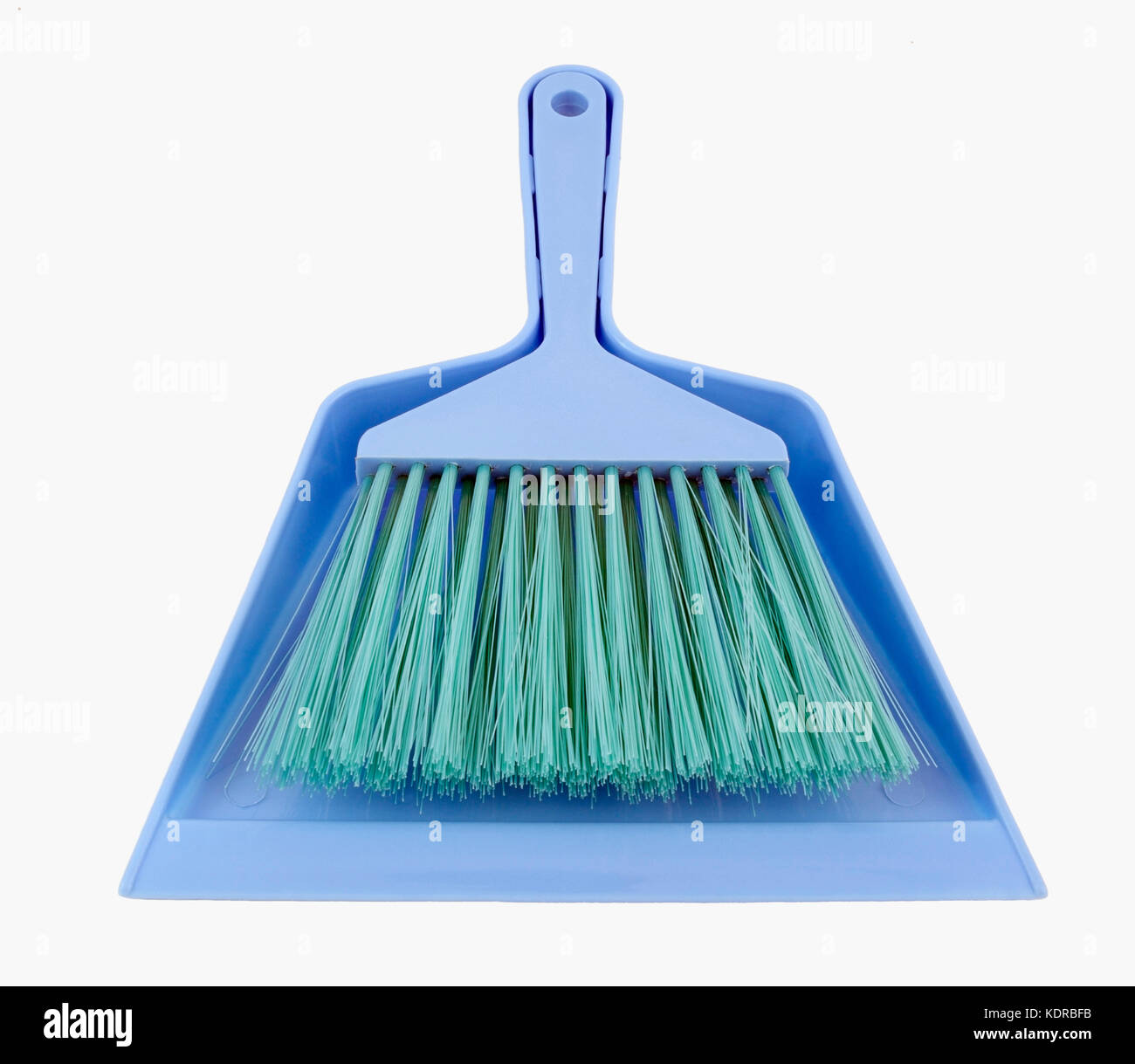 Simple inexpensive plastic dustpan and hand broom. Isolated. Stock Photo