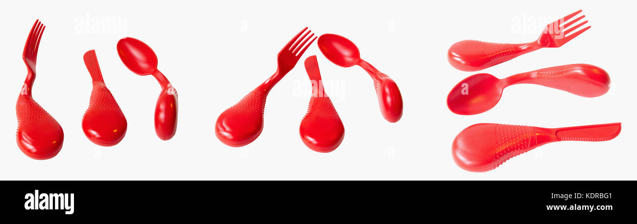 Three views of ergonomic set of red plastic dining utensils: spoon, knife and fork. Isolated. Stock Photo