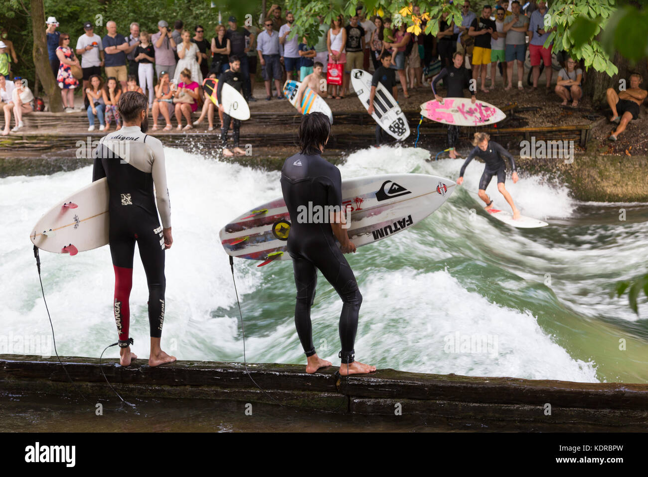 Surfer surfing an artificial wave in Munich city center, Germany. Stock Photo