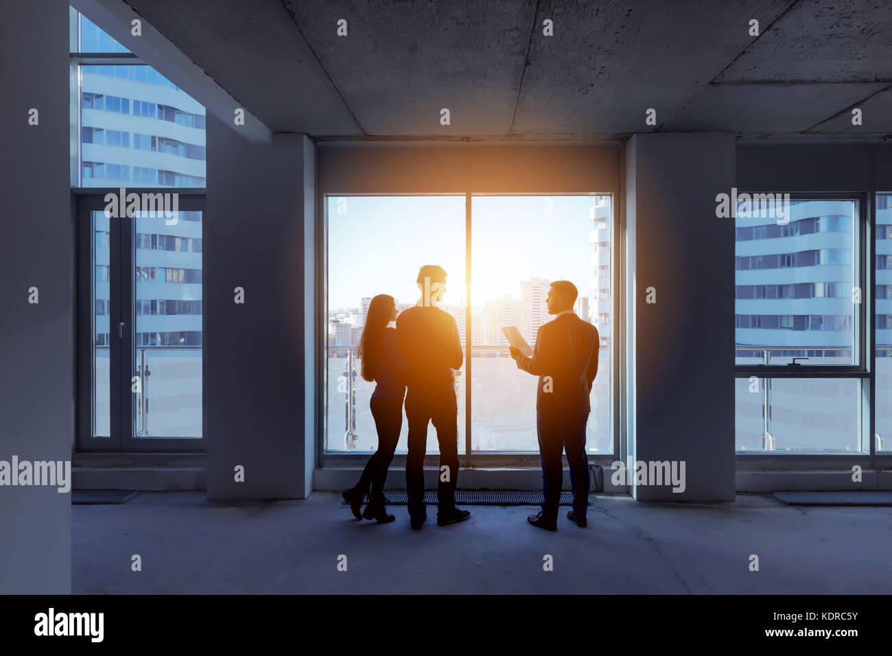 Silhouettes couple real estate agent apartment city Stock Photo