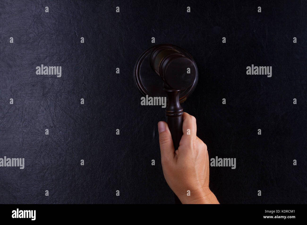 Hand holding law gavel Stock Photo Alamy