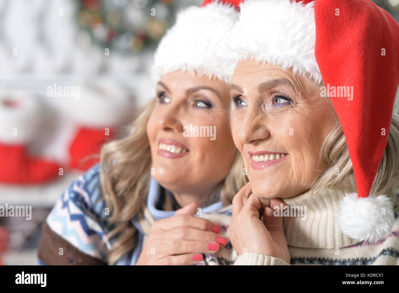 Two women celebrating Christmas Stock Photo Alamy