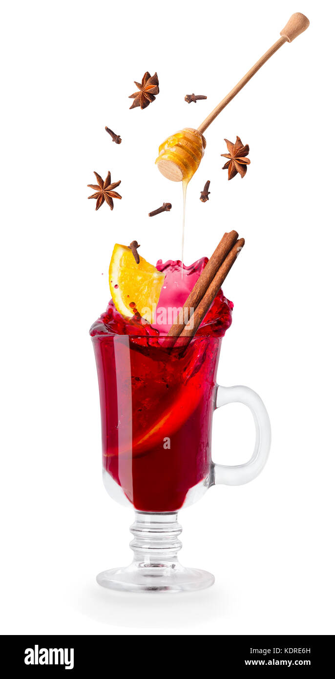 mulled wine with splash and flying ingredients Stock Photo