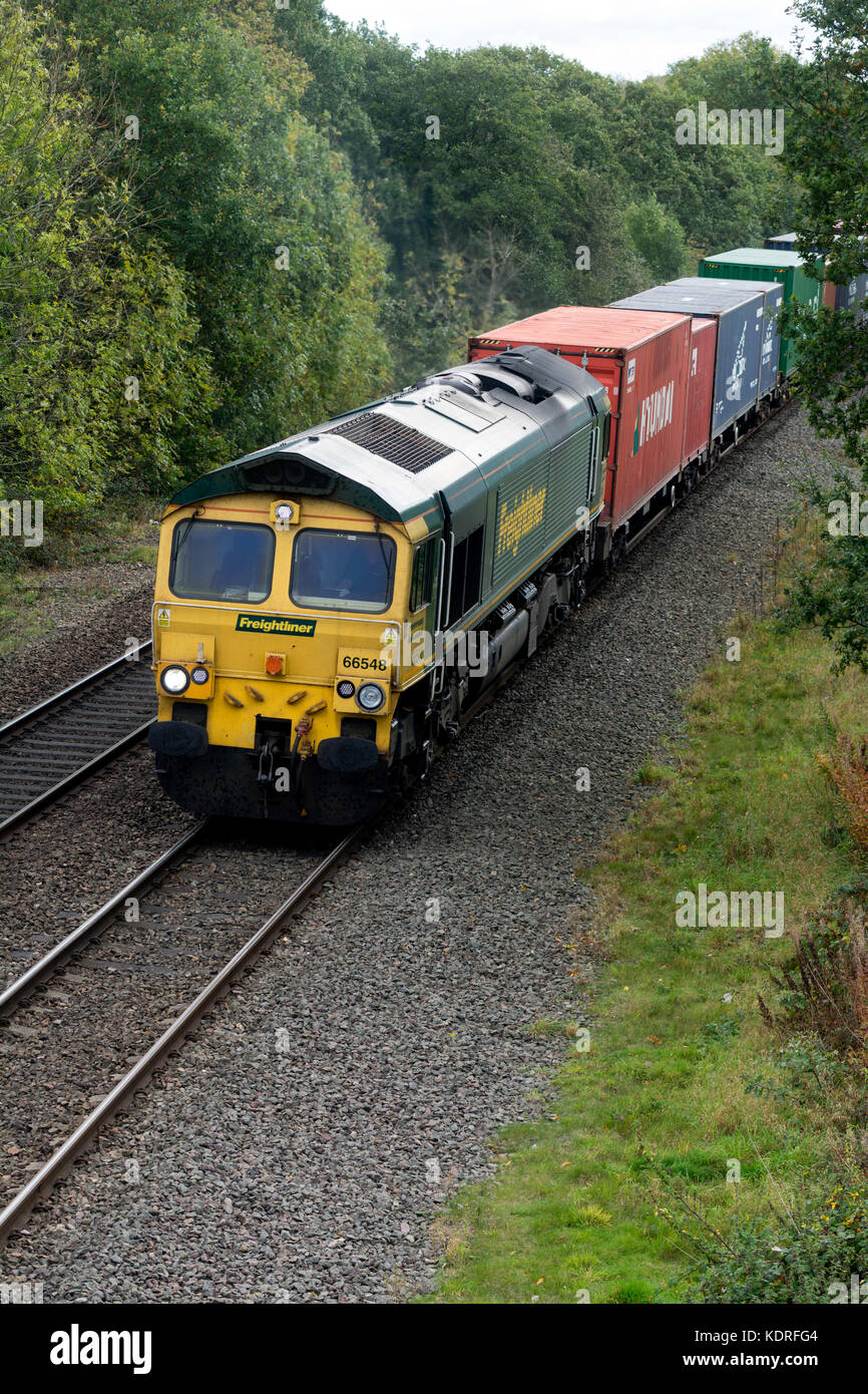 Class 66 diesel locomotive pulling a freightliner train, Warwickshire, UK Stock Photo