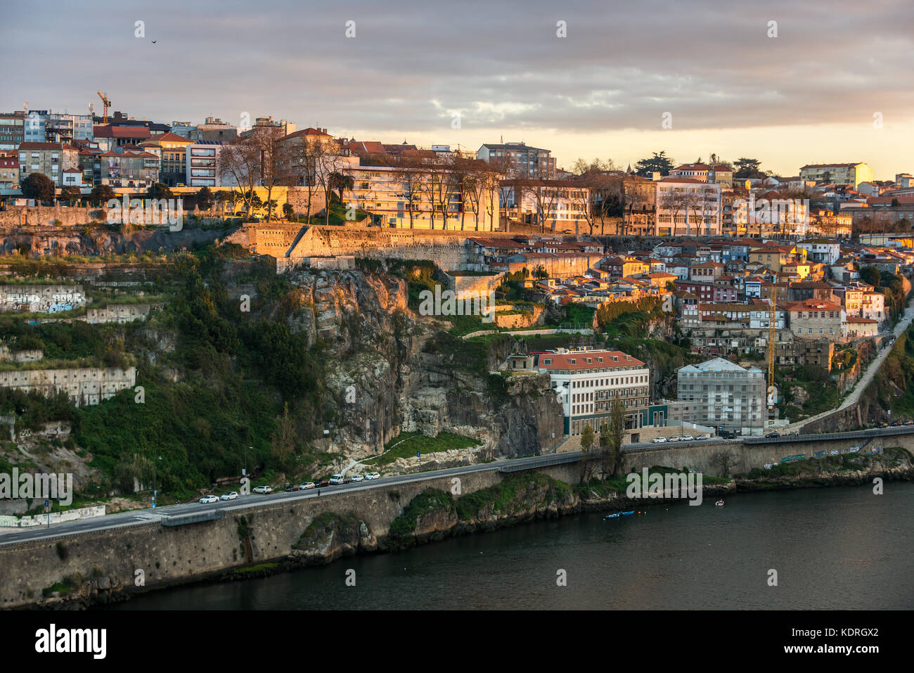 View on a building on a bank of Douro River in Porto city on Iberian Peninsula, second largest city in Portugal. Eurostars Porto Douro hotel on photo Stock Photo