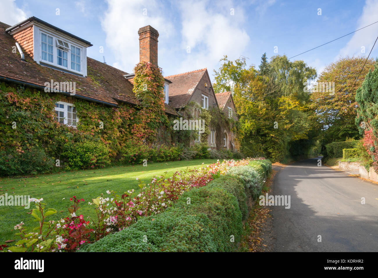 Pretty cottages and gardens in Greywell village, Hampshire, UK in autumn Stock Photo