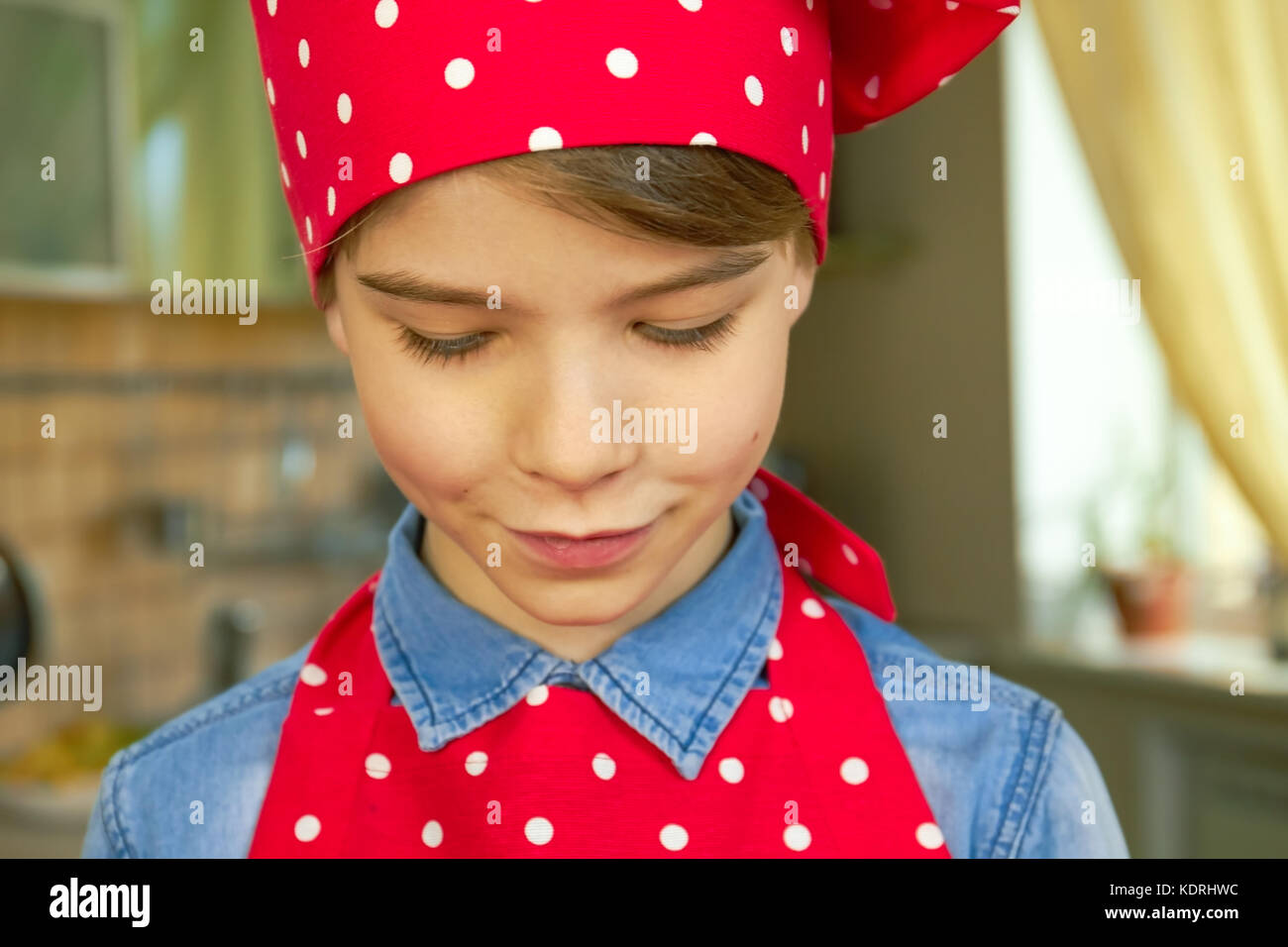 Caucasian boy in chef uniform Stock Photo Alamy